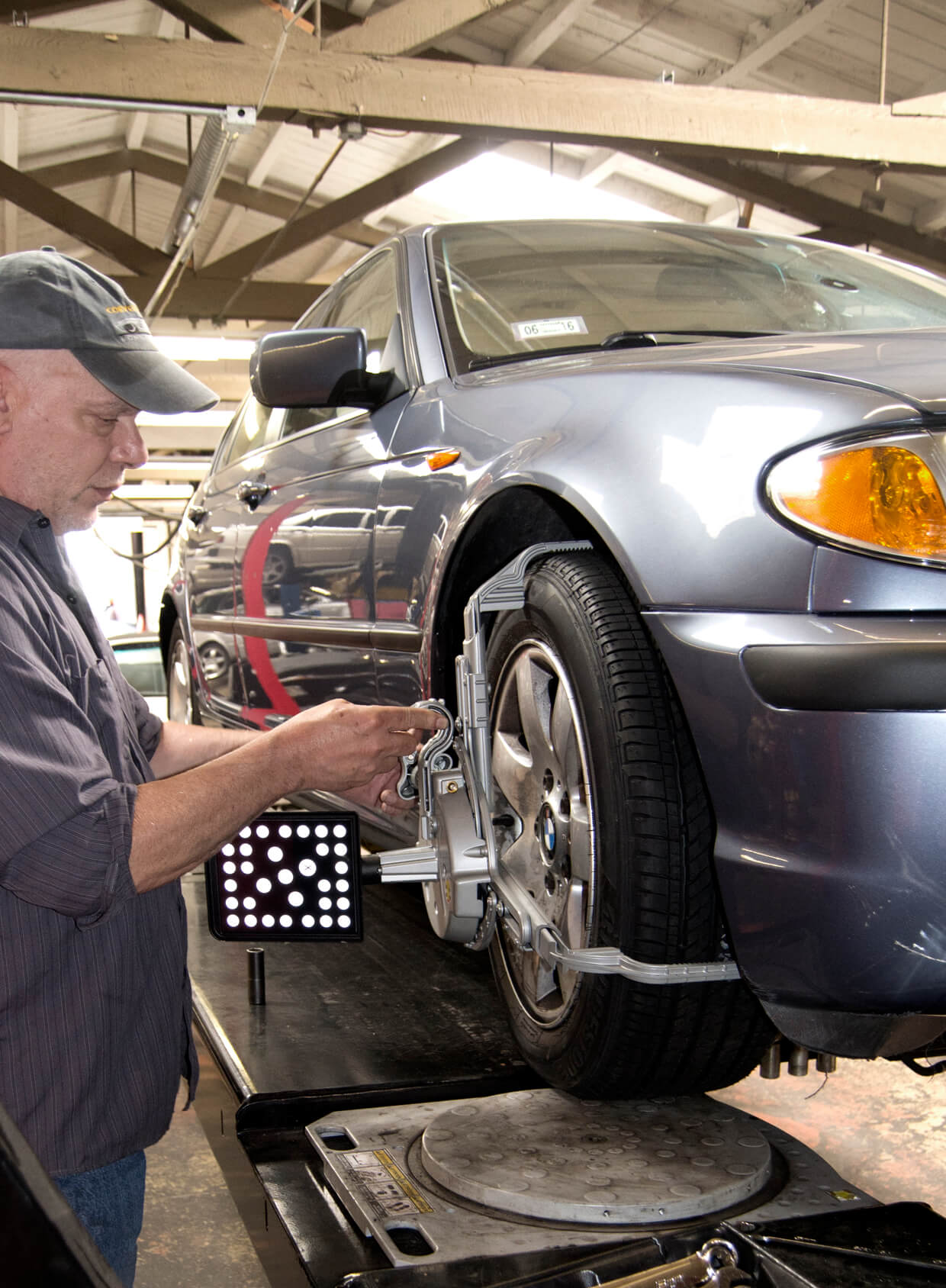Mechanic Checking BMW Wheel Alignemnt